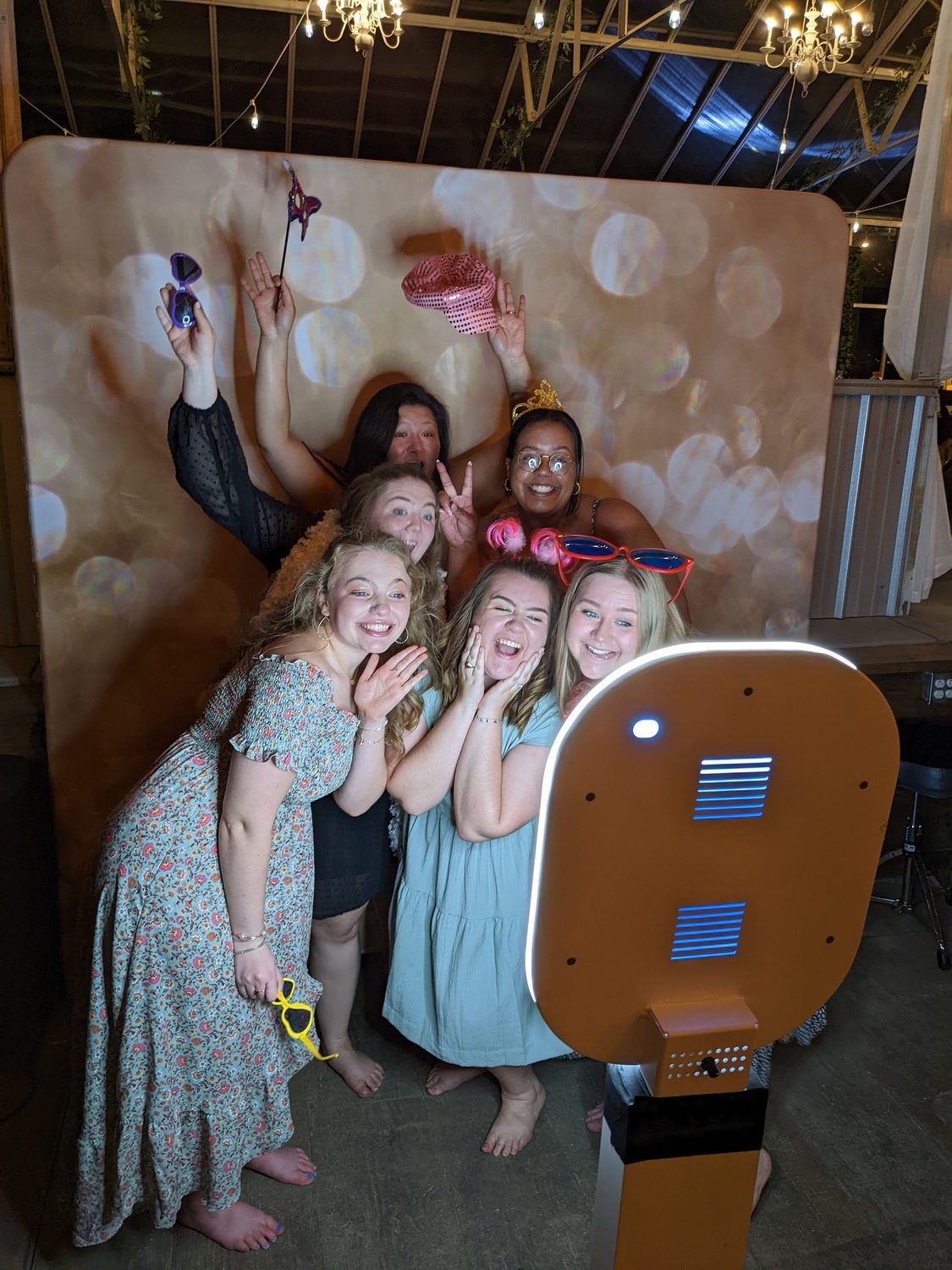 Group of guests in an open-air photo booth
