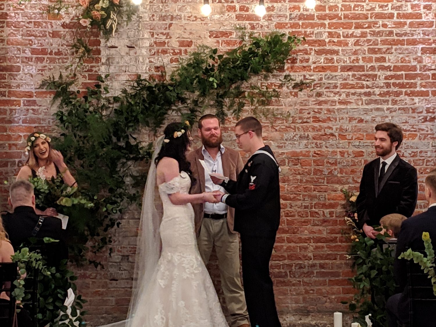 Outdoor ceremony set with chairs and florals