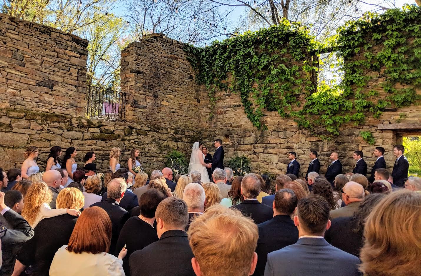 Ceremony chairs and aisle styled at a garden venue