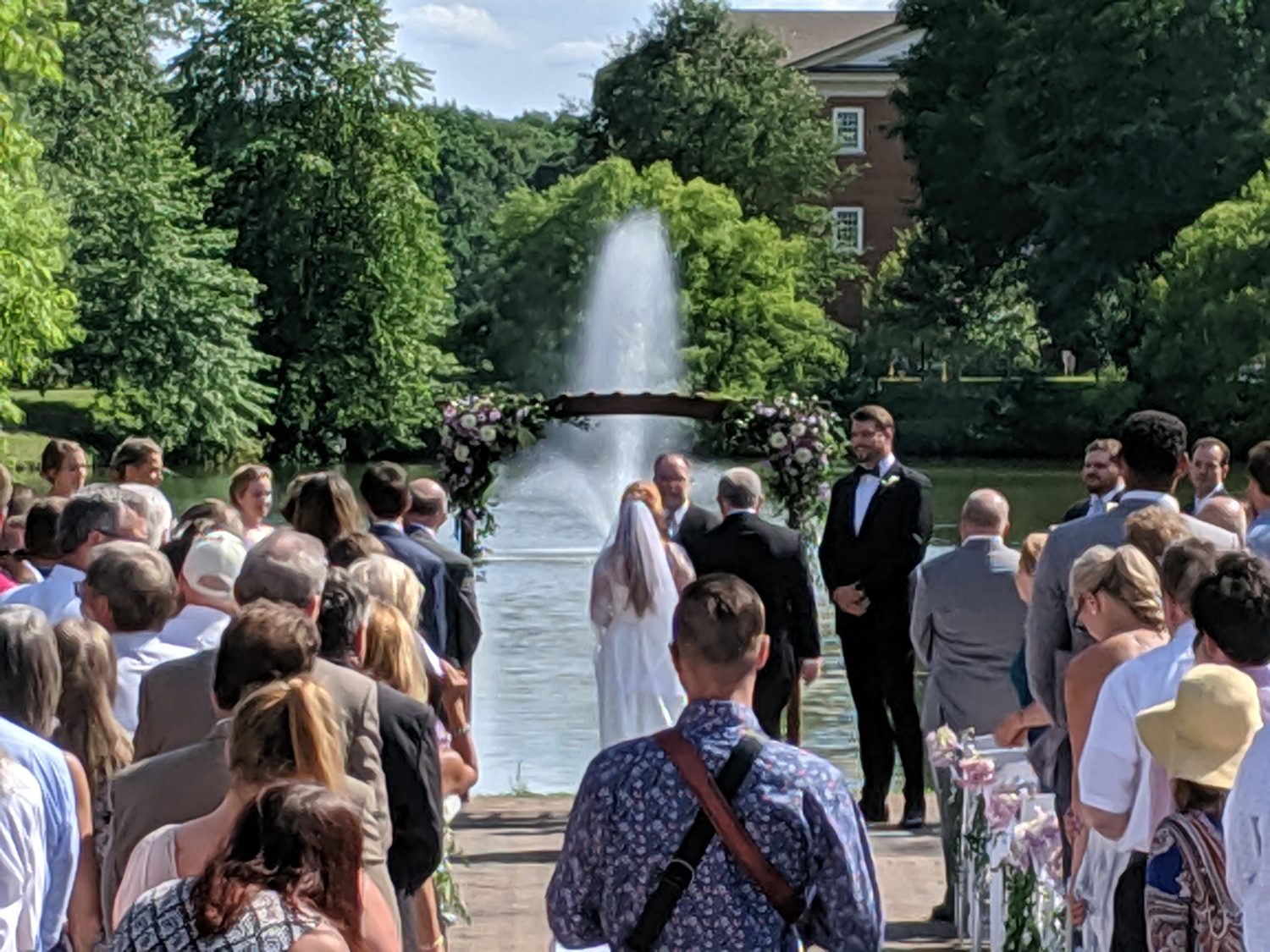 Guests seated for an outdoor ceremony