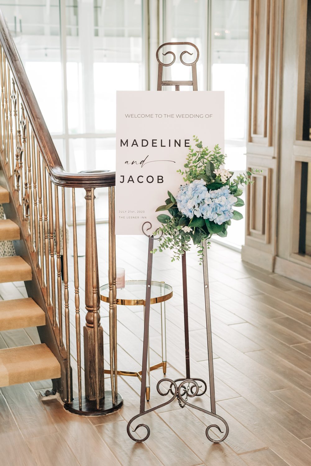 Welcome table with signage and framed photographs