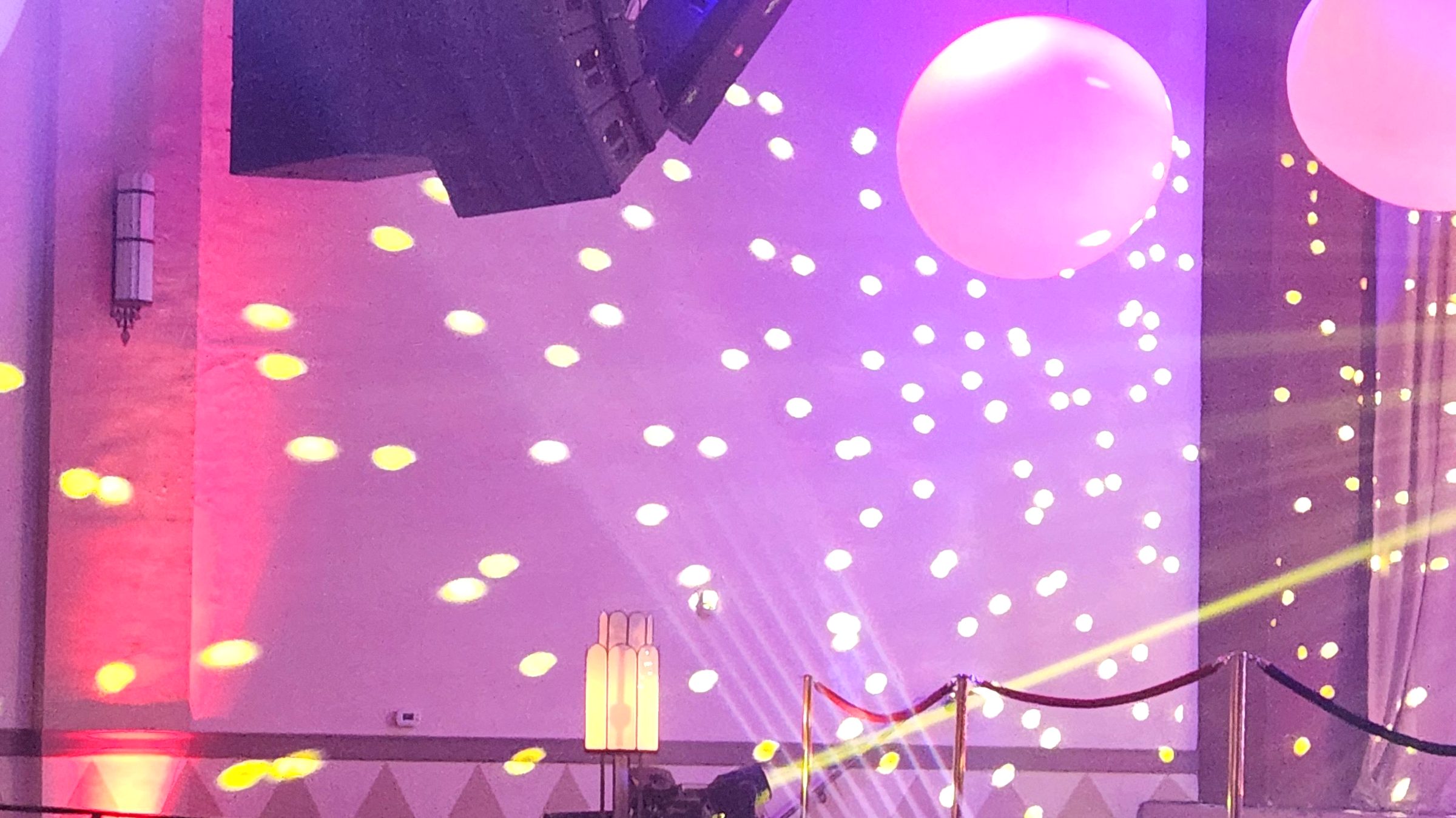 Dance floor lighting, speakers and the DJ booth set up for prom at The Hippodrome in Richmond